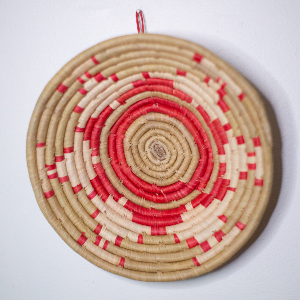 JustOne's red and neutral hanging basket handwoven in Uganda