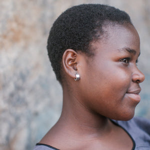 JustOne's silver small hoops that hug your ear, handcrafted in Kenya