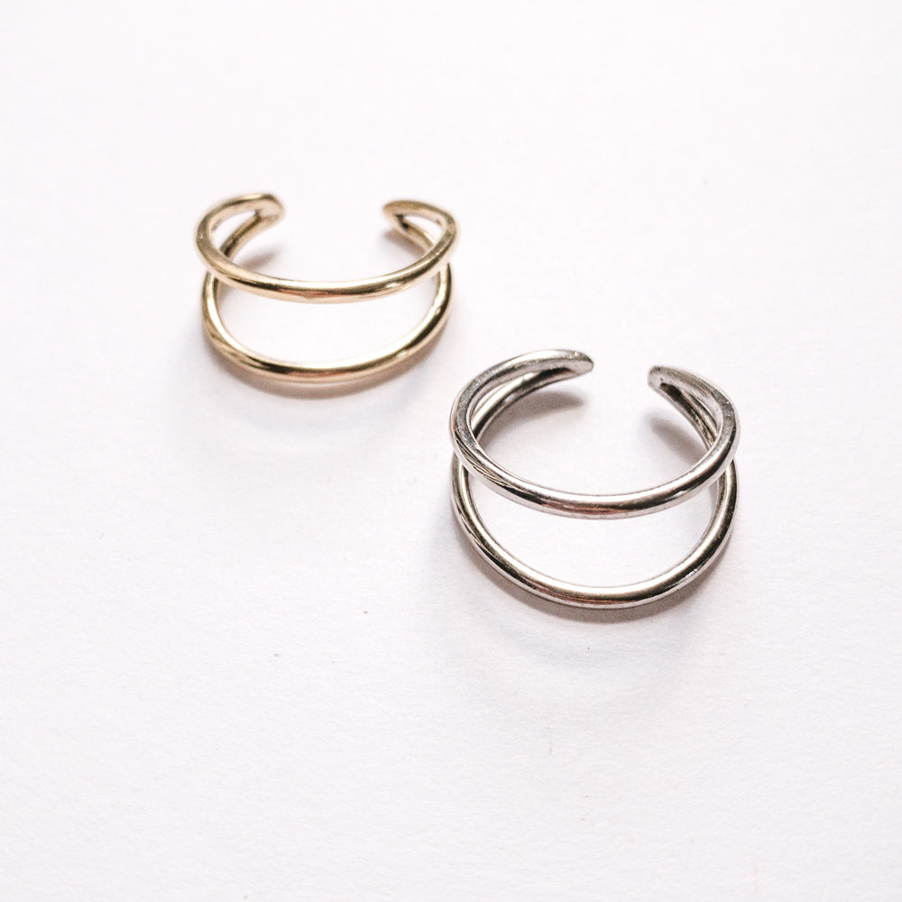 JustOne's brass and silver adjustable rings with two bands to seem like two rings, handcrafted in Kenya