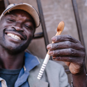 JustOne's small handcrafted, wooden, coffee spoon with striped handle made of ethically sourced bone, made in Kenya